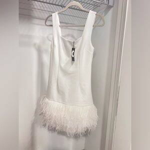 Elegant White Dress with Feather Hem